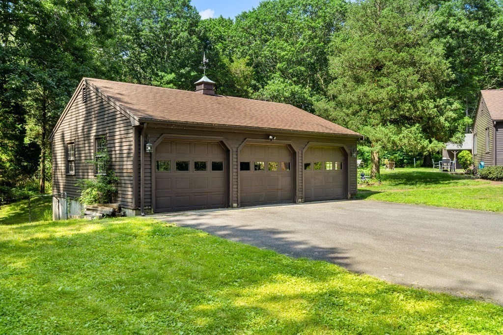 10 Beaver Pond Road Beverly, MA 01915 - Photo 4 of 39 a view of a house with a yard and large trees