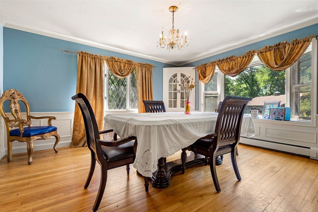 10 Beaver Pond Road Beverly, MA 01915 - Photo 9 of 39 a view of a dining room with furniture window and wooden floor