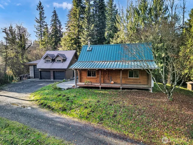 an aerial view of a house with a garden and yard