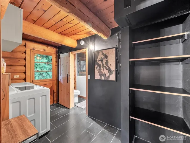 a kitchen with a refrigerator and window