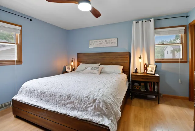 a bedroom with a bed and window