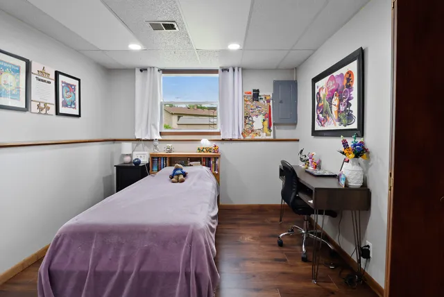 a bedroom with furniture and a window