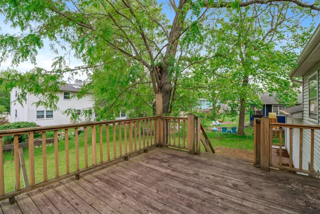 a view of backyard with outdoor seating and green space