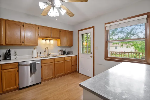 a kitchen with a stove a sink and a refrigerator