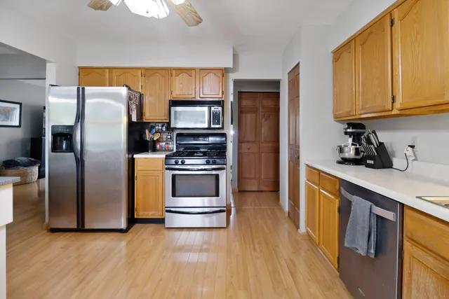 a kitchen with stainless steel appliances a refrigerator stove and sink