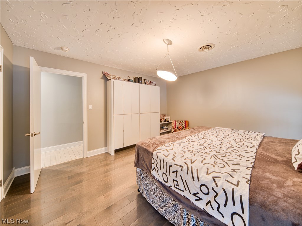 32199 Cedar Road Cleveland, OH 44124 - Photo 18 of 31 Bedroom featuring light hardwood / wood-style flooring