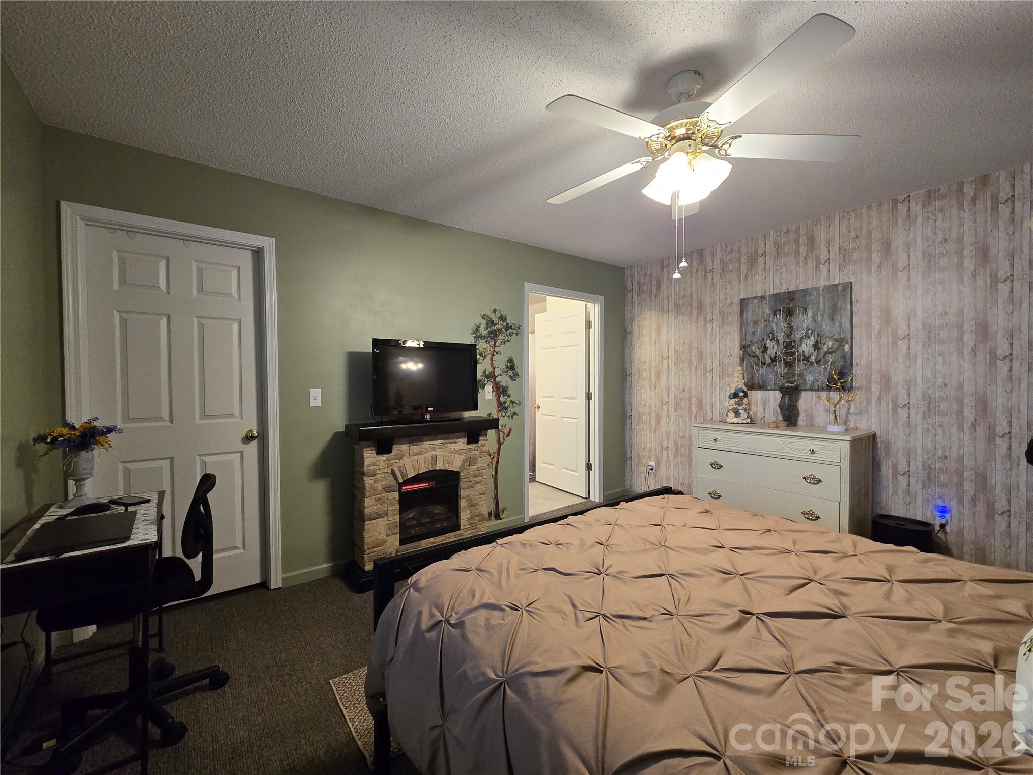 505 2nd St Place Northeast, Unit D2 Conover, NC 28613 - Photo 11 of 21 a bedroom with a bed and a flat screen tv