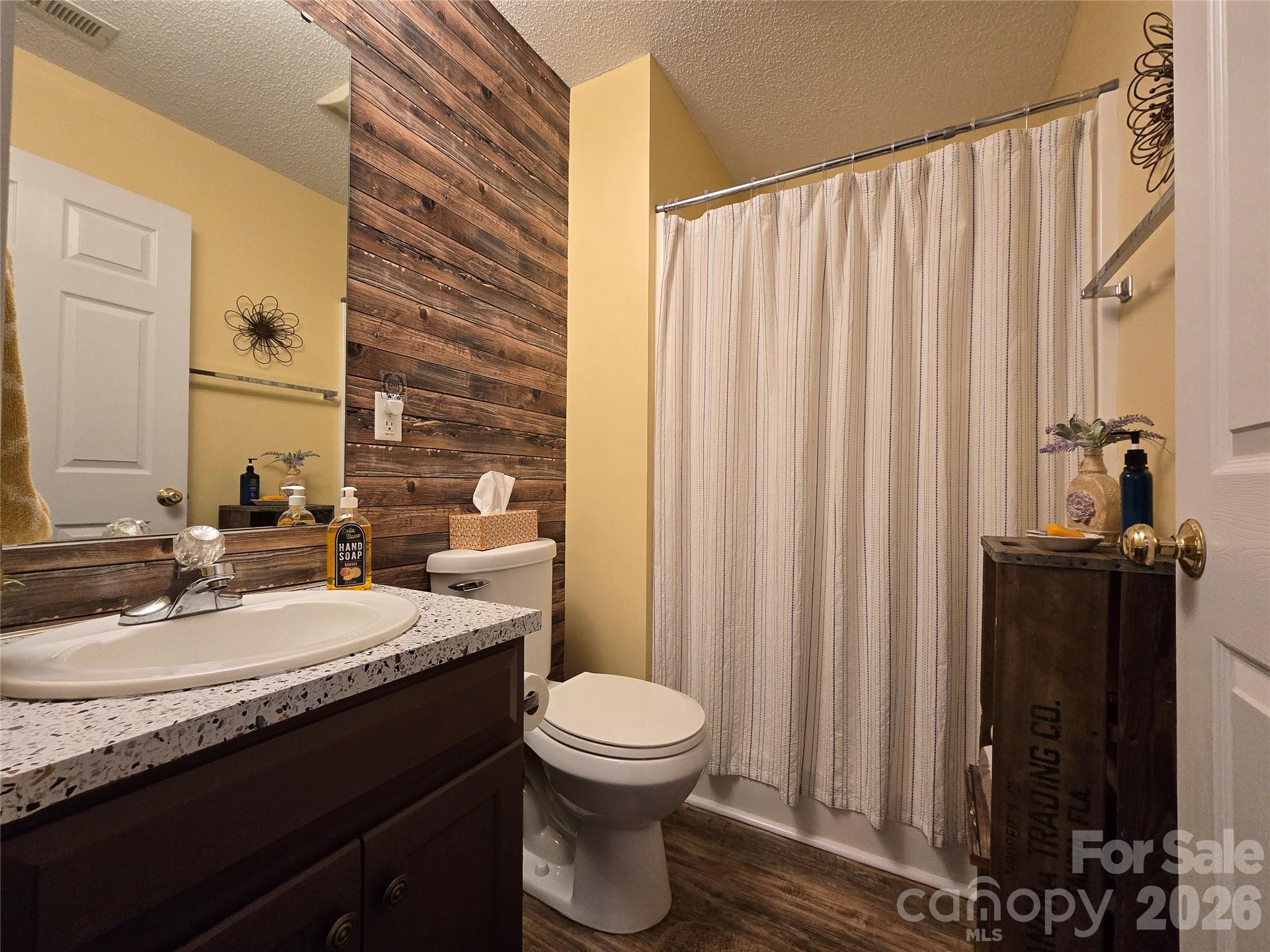 505 2nd St Place Northeast, Unit D2 Conover, NC 28613 - Photo 15 of 21 a bathroom with a granite countertop sink toilet and mirror