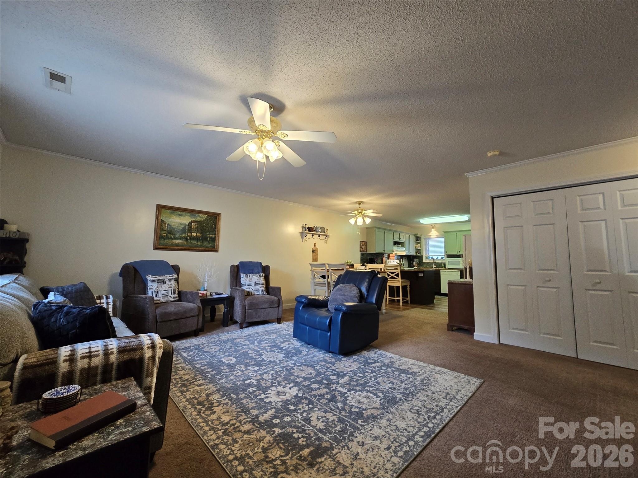 505 2nd St Place Northeast, Unit D2 Conover, NC 28613 - Photo 3 of 21 a living room with furniture a dining table and kitchen view