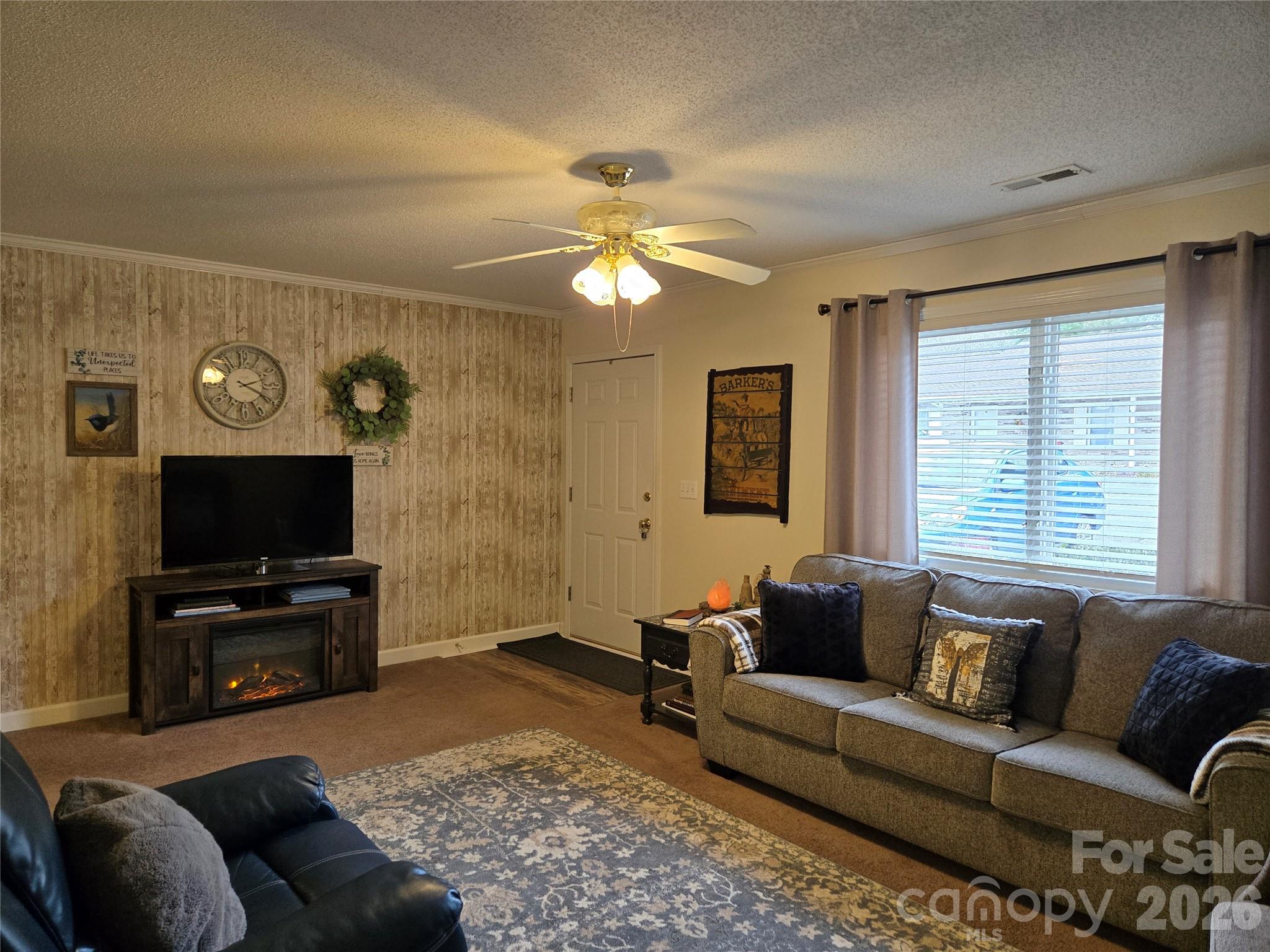 505 2nd St Place Northeast, Unit D2 Conover, NC 28613 - Photo 5 of 21 a living room with furniture and a flat screen tv