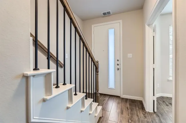 a view of staircase with wooden floor and staircase