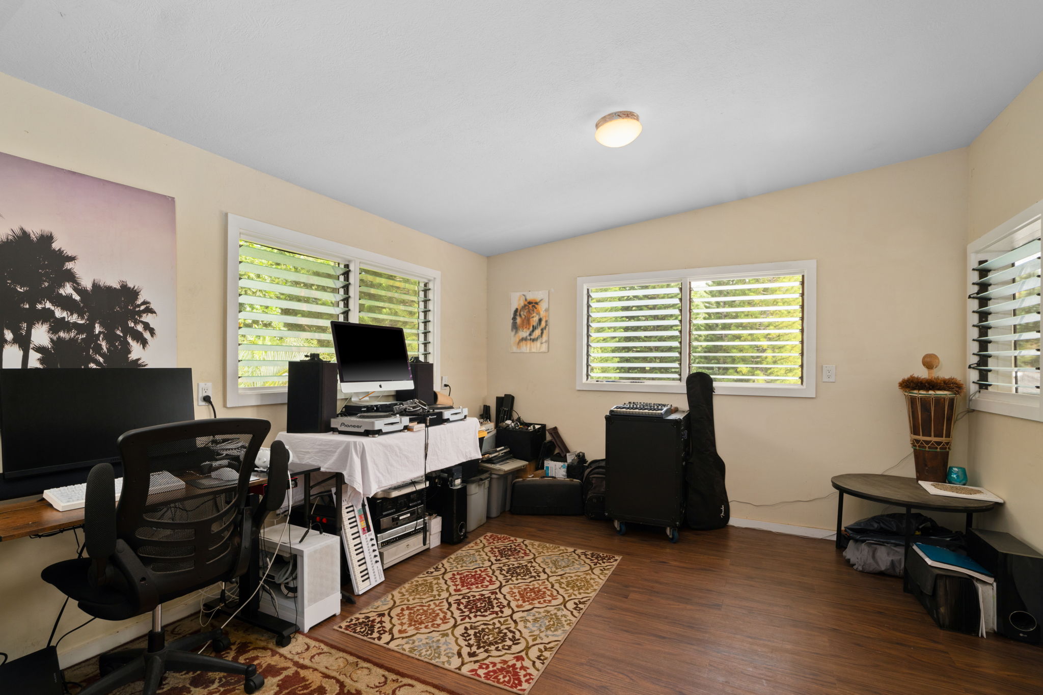 4906 Aliali Road Kapaa, HI 96746 - Photo 13 of 30 a living room with furniture and a flat screen tv