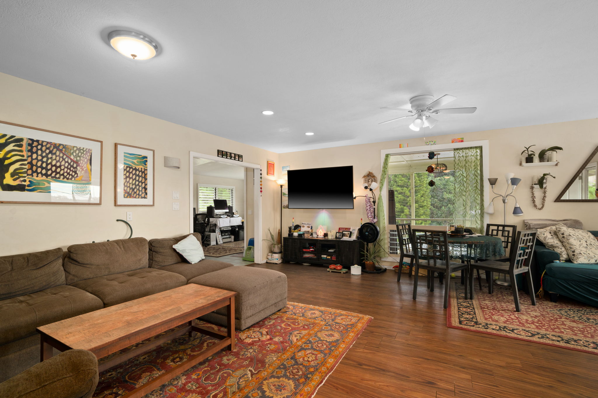 4906 Aliali Road Kapaa, HI 96746 - Photo 16 of 30 a living room with furniture wooden floor and floor to ceiling window