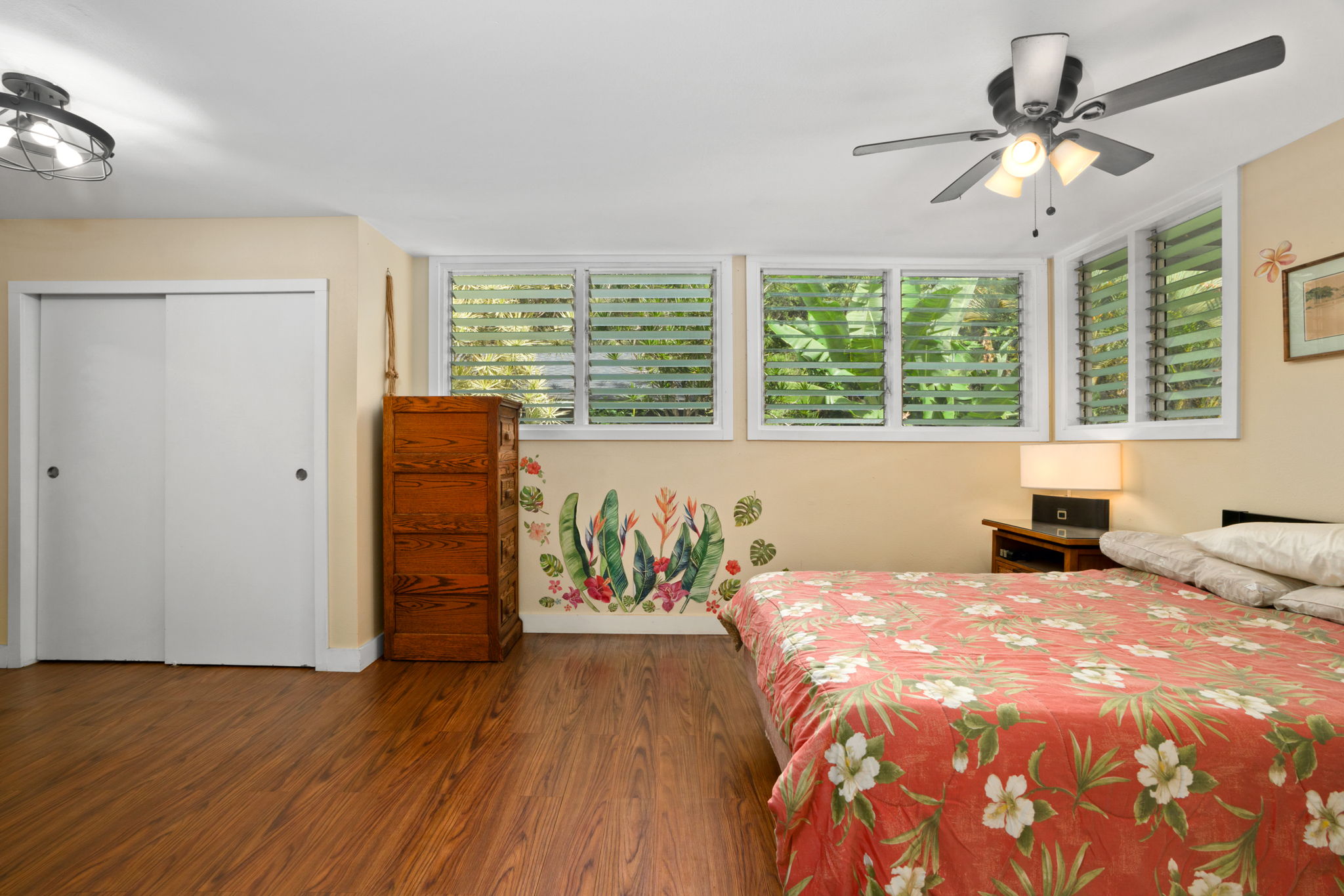 4906 Aliali Road Kapaa, HI 96746 - Photo 23 of 30 a bedroom with a bed and a chandelier