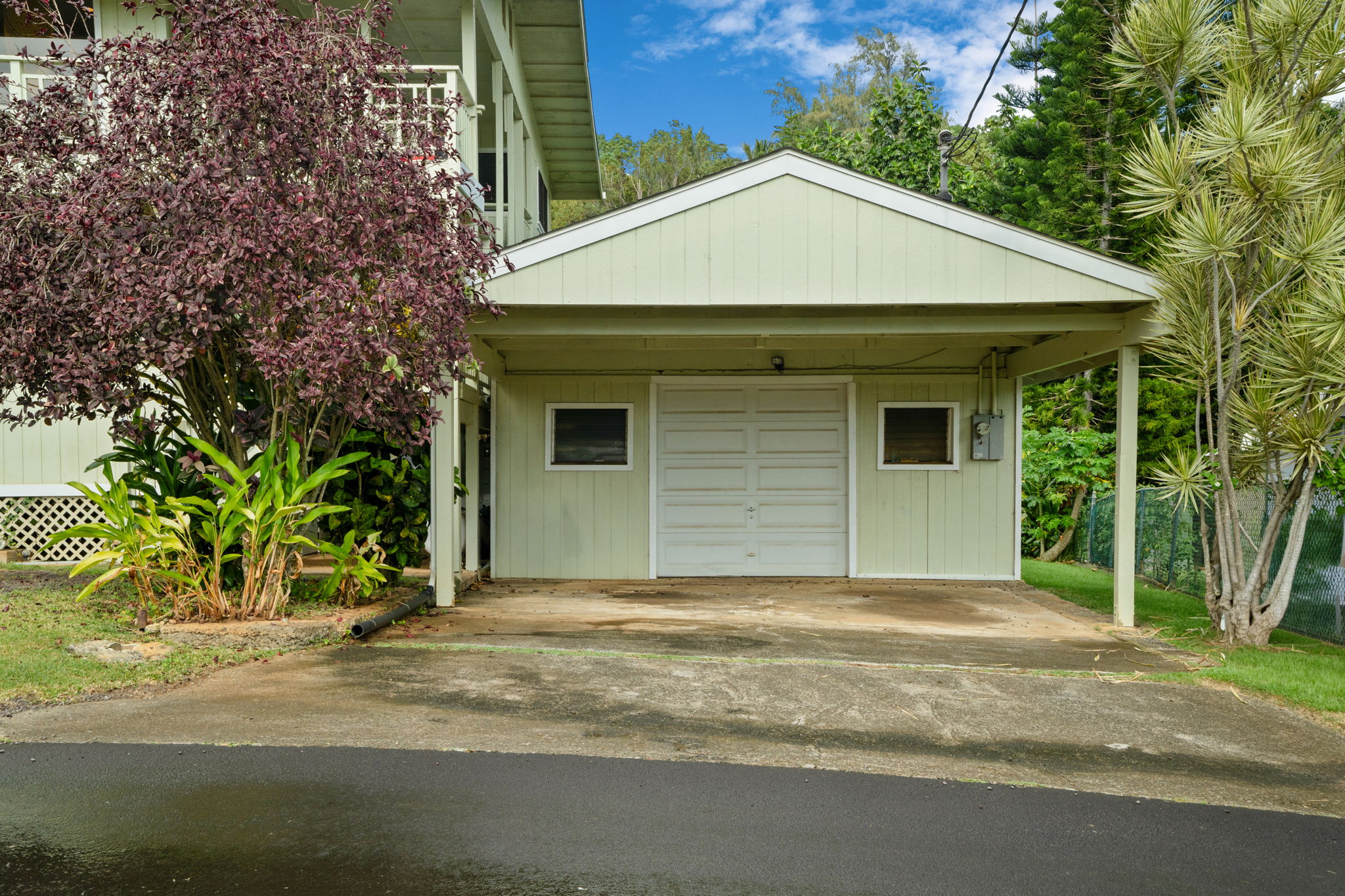 4906 Aliali Road Kapaa, HI 96746 - Photo 26 of 30 a front view of a house with a yard and garage