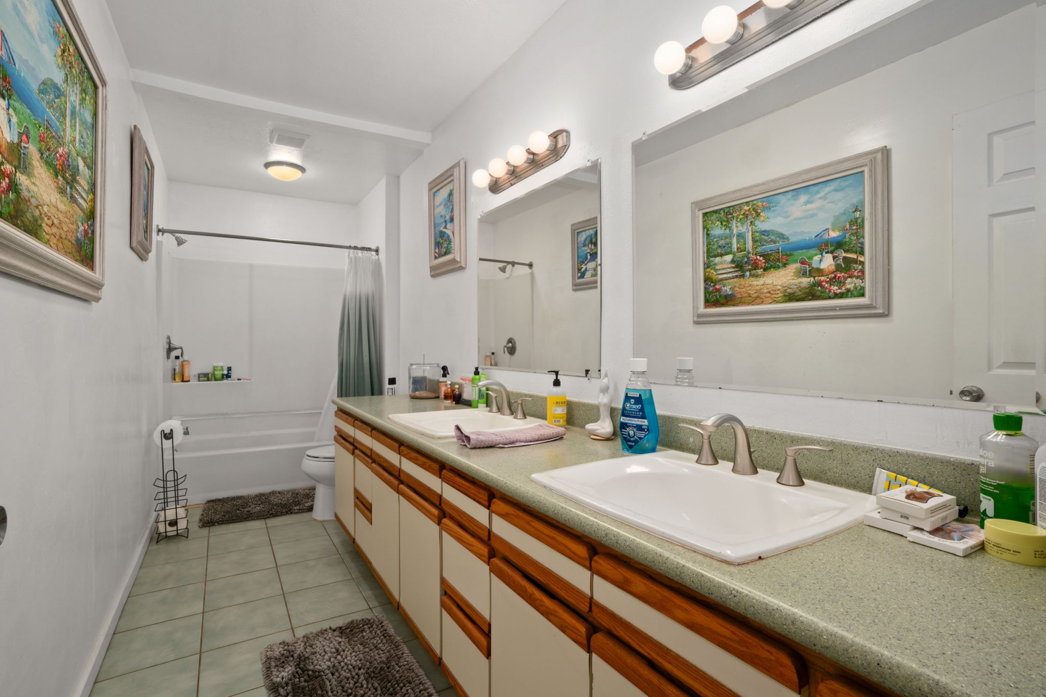 4906 Aliali Road Kapaa, HI 96746 - Photo 6 of 30 a spacious bathroom with a double vanity sink a mirror and a bathtub