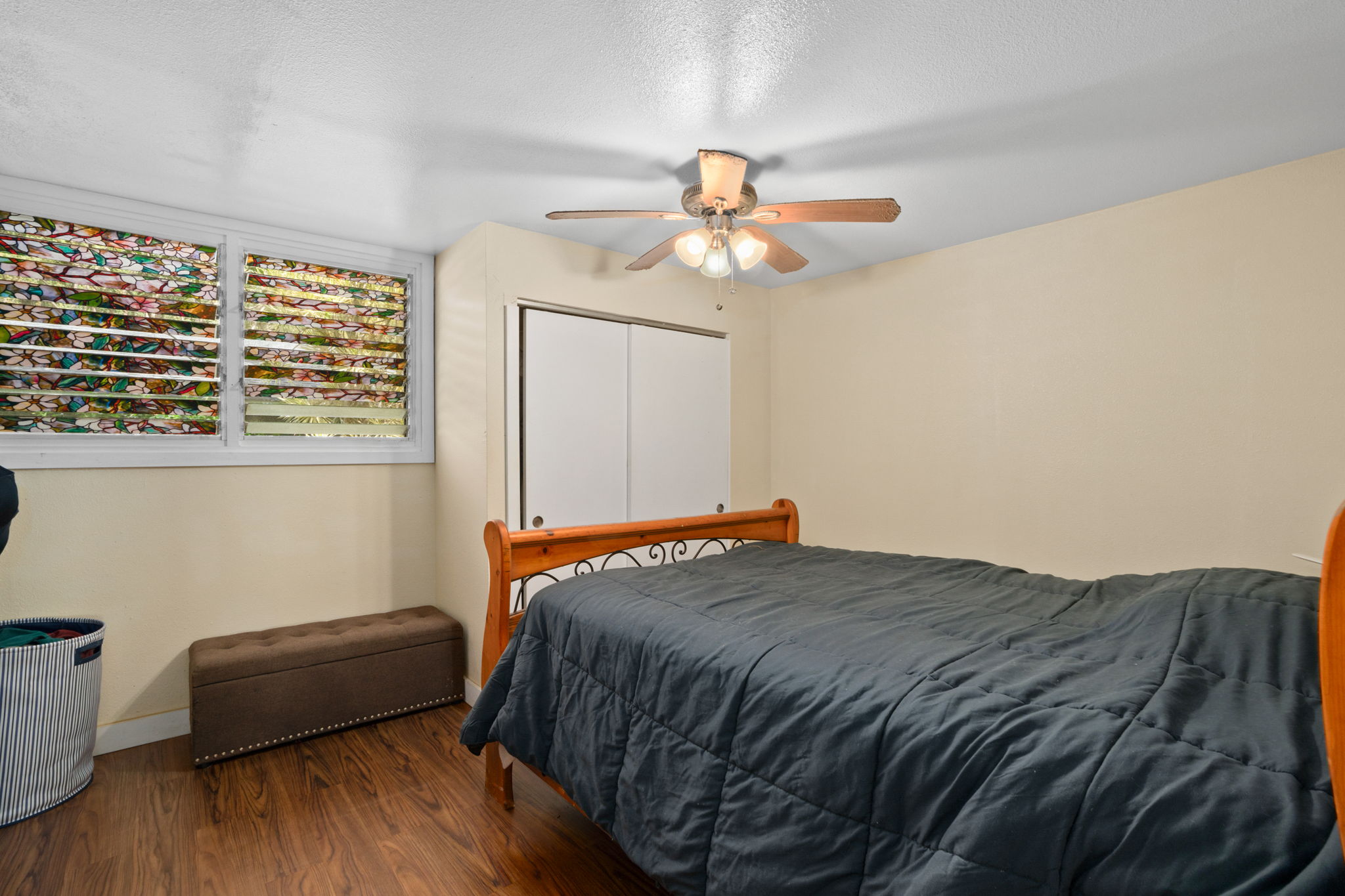 4906 Aliali Road Kapaa, HI 96746 - Photo 8 of 30 a bedroom with a bed and a chandelier
