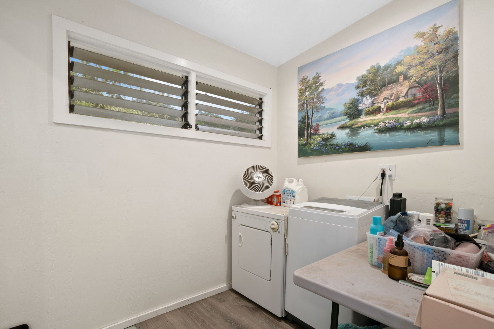 4906 Aliali Road Kapaa, HI 96746 - Photo 10 of 30 a view of a room that has a couch and wooden floor