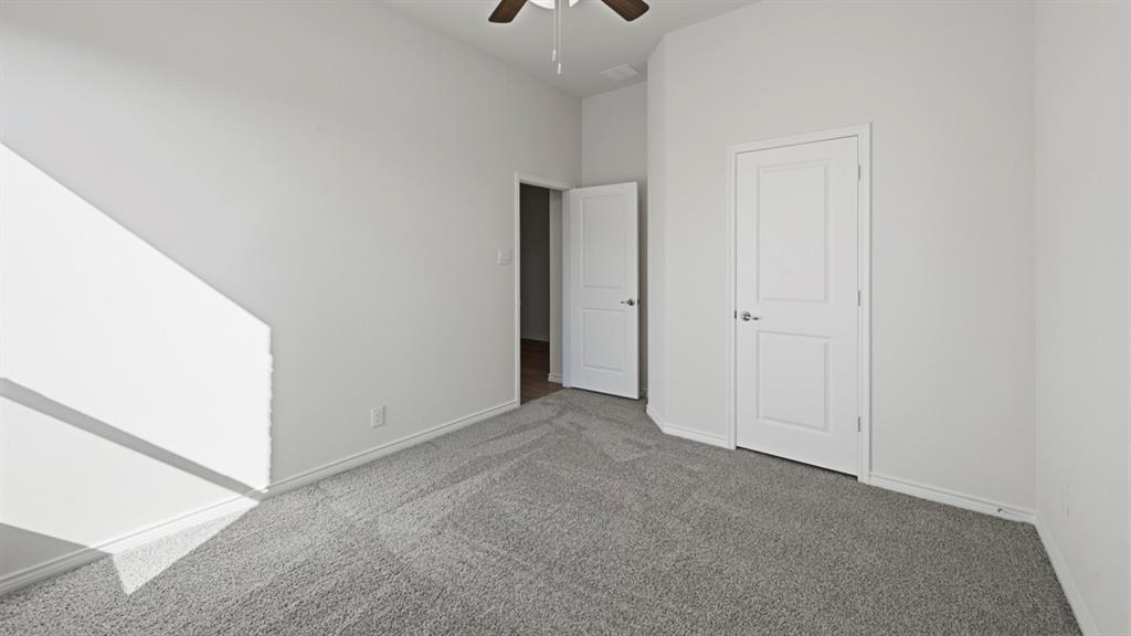 4163 Waldron Trail Forney, TX 75126 - Photo 21 of 30 Neutral-toned room featuring light gray carpeting and white walls