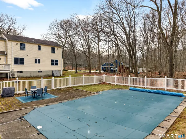 a view of swimming pool with a patio