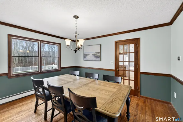 a dining room with furniture and window