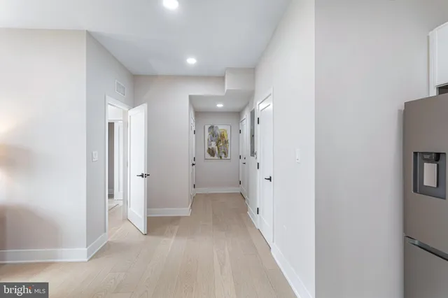 a view of a hallway with white walls