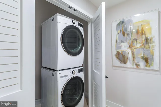 a view of a hallway with washer and dryer