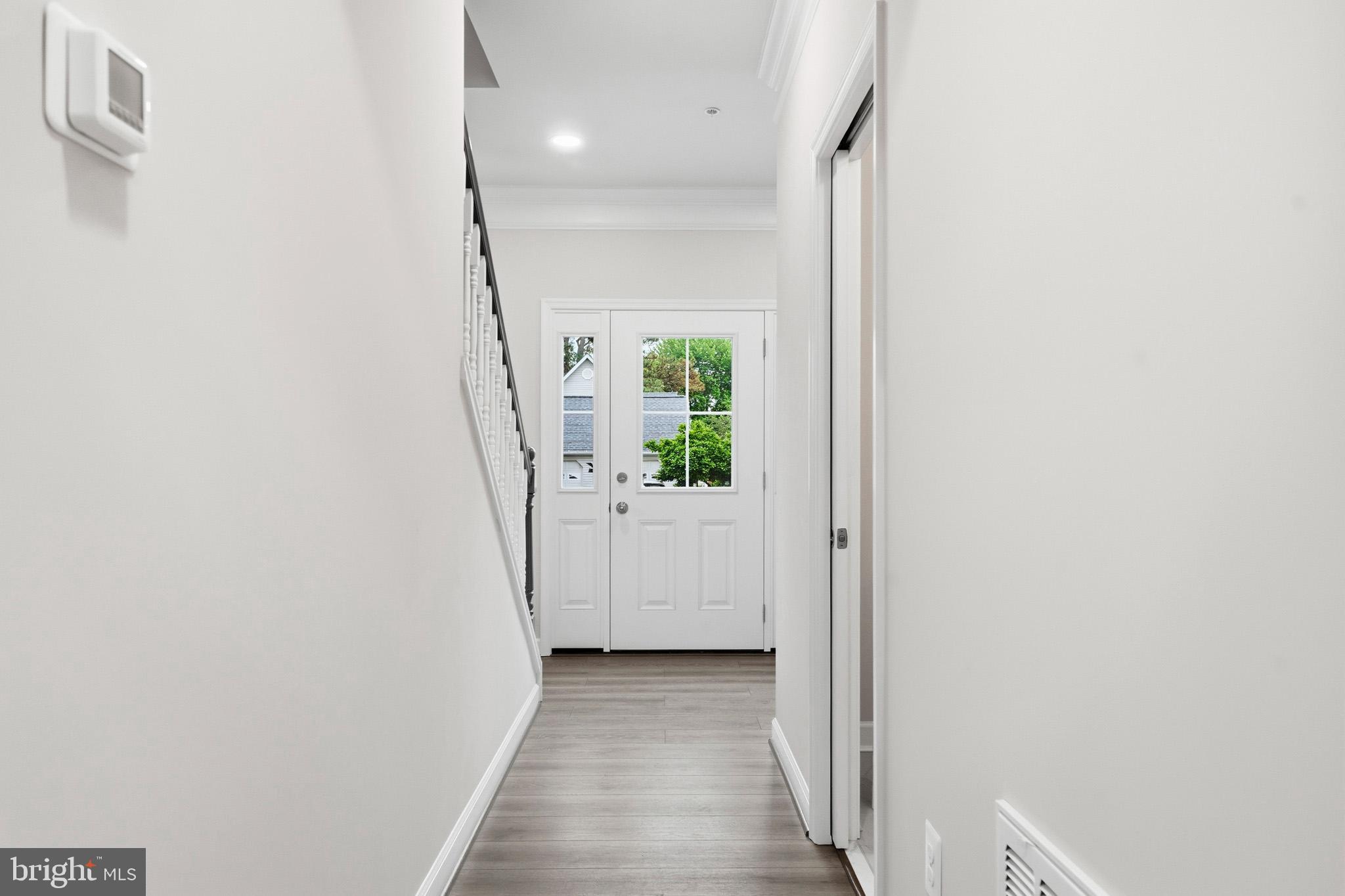 29725 Bruce Road Mechanicsville, MD 20659 - Photo 27 of 79 a view of a hallway with wooden floor and stairs