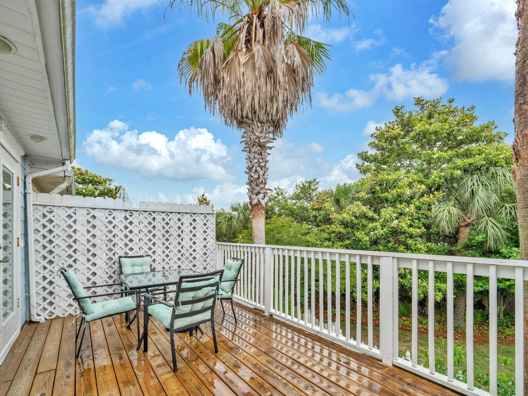 50 Gossamer Lane, Unit 10 Inlet Beach, FL 32461 - Photo 11 of 46 a balcony with table and chairs
