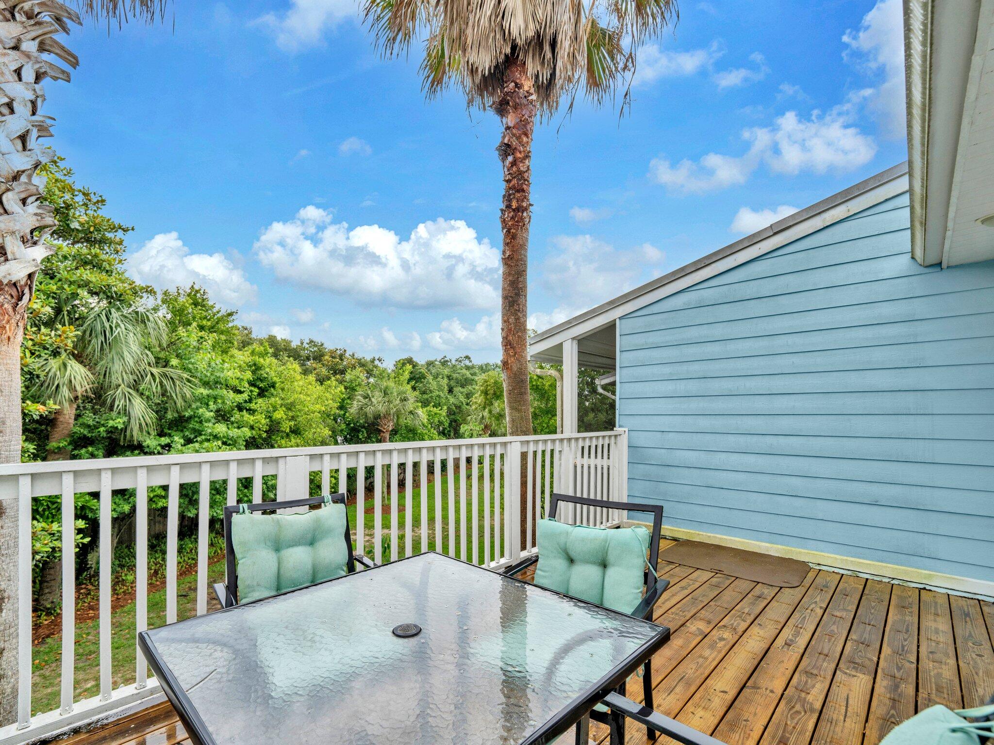 50 Gossamer Lane, Unit 10 Inlet Beach, FL 32461 - Photo 12 of 46 a balcony with wooden floor and fence