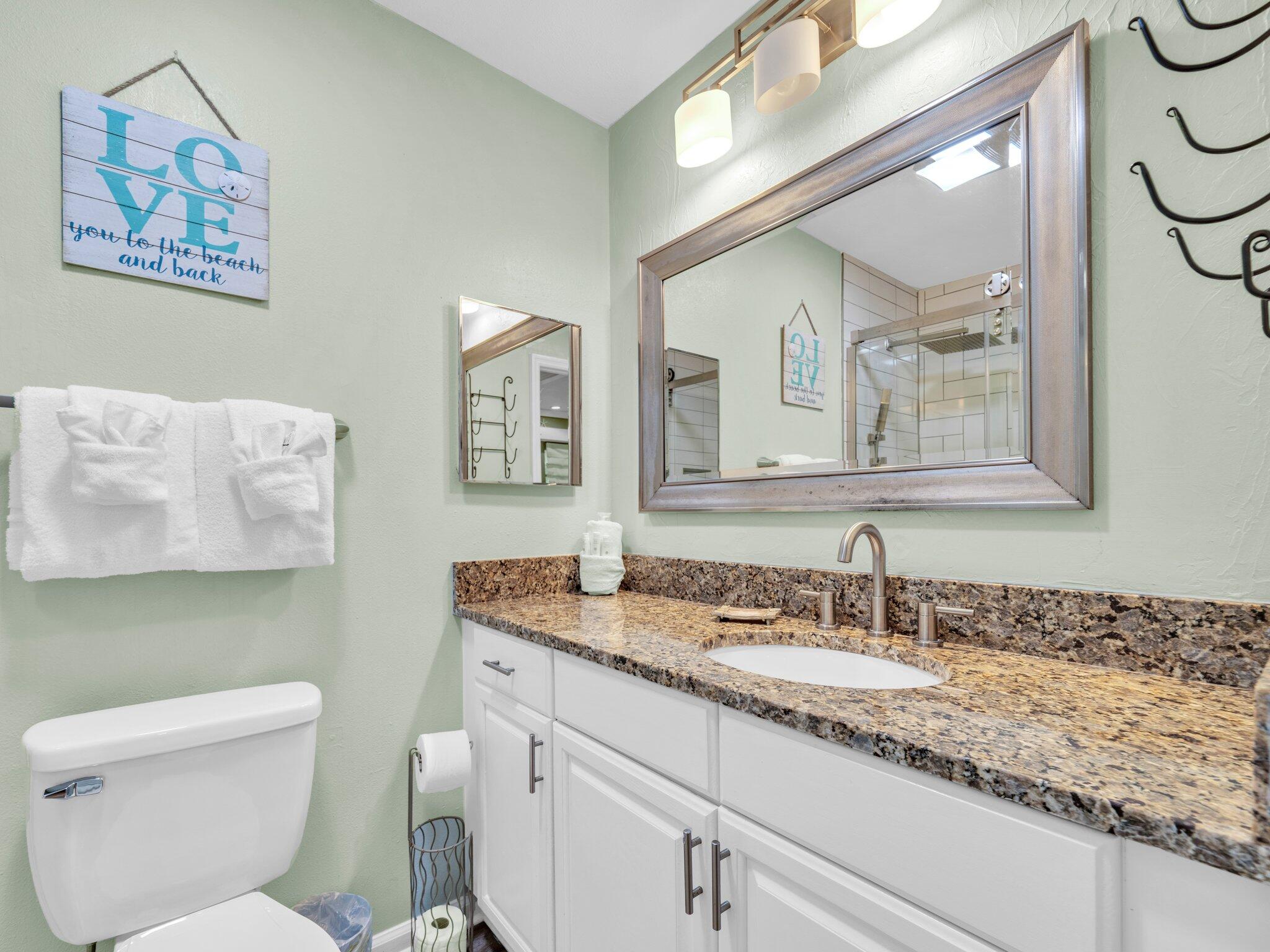50 Gossamer Lane, Unit 10 Inlet Beach, FL 32461 - Photo 17 of 46 a bathroom with a toilet a sink and mirror
