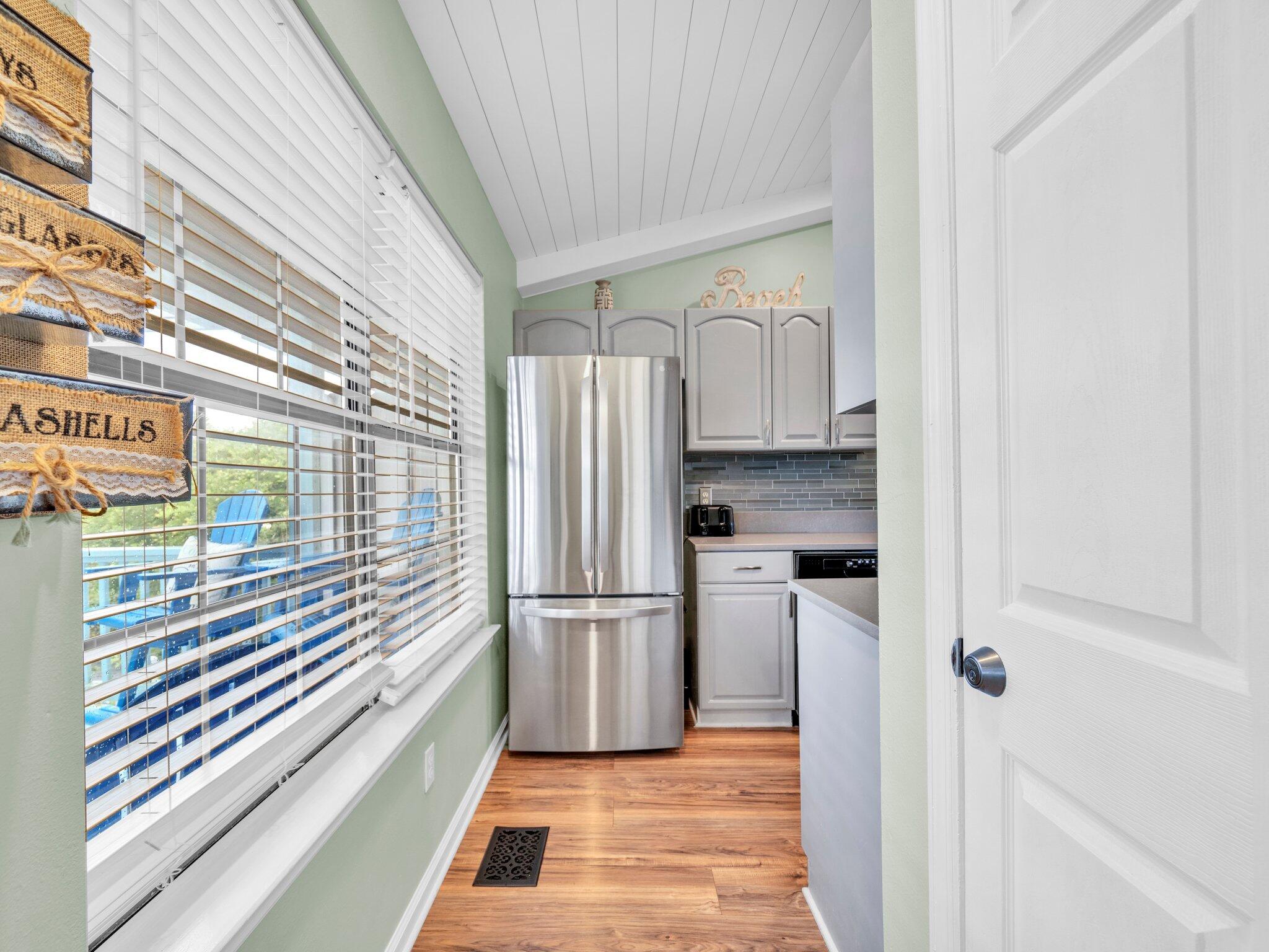 50 Gossamer Lane, Unit 10 Inlet Beach, FL 32461 - Photo 28 of 46 a kitchen with a refrigerator and a sink