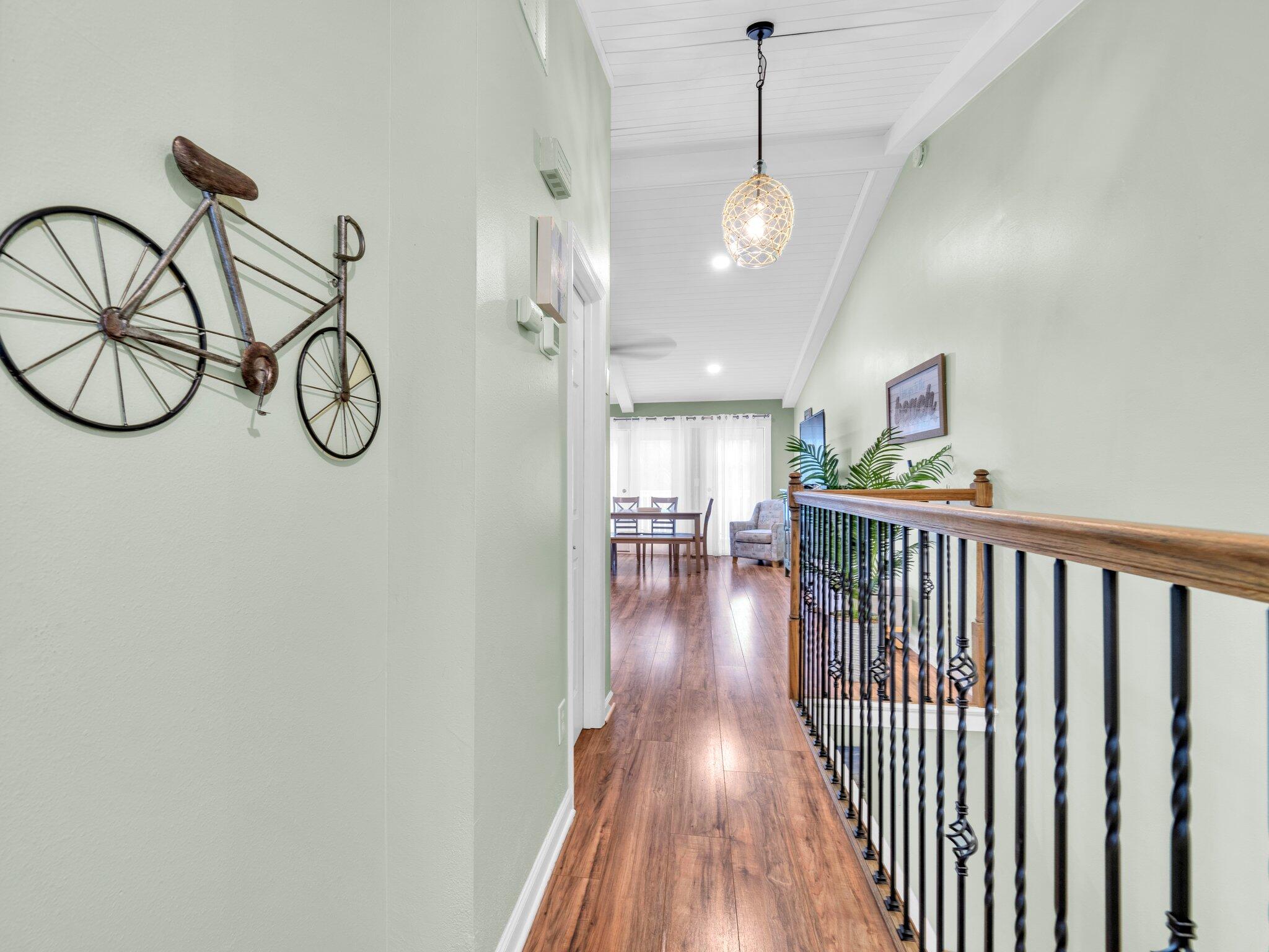 50 Gossamer Lane, Unit 10 Inlet Beach, FL 32461 - Photo 5 of 46 a view of a hallway with wooden floor and chandelier