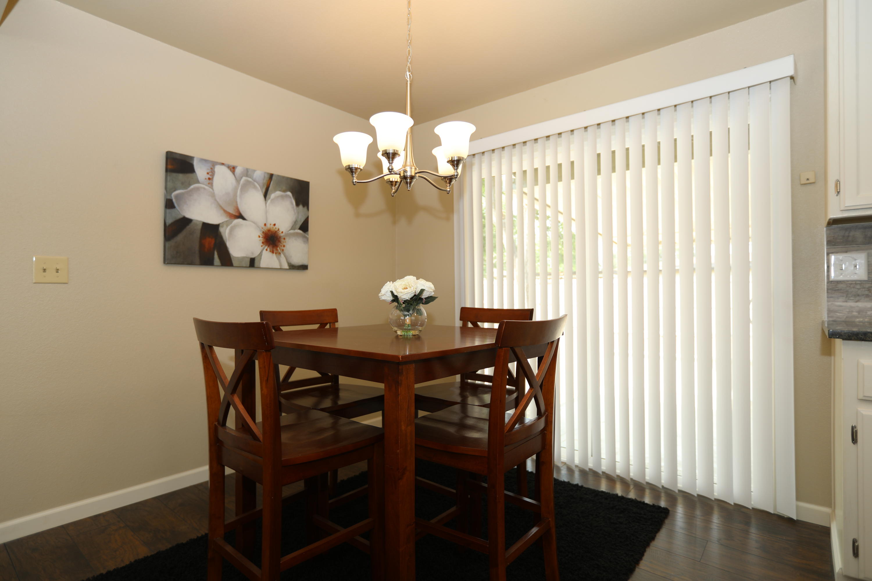 6560 Riverside Drive Redding, CA 96001 - Photo 3 of 15 a view of a dining room with furniture and wooden floor