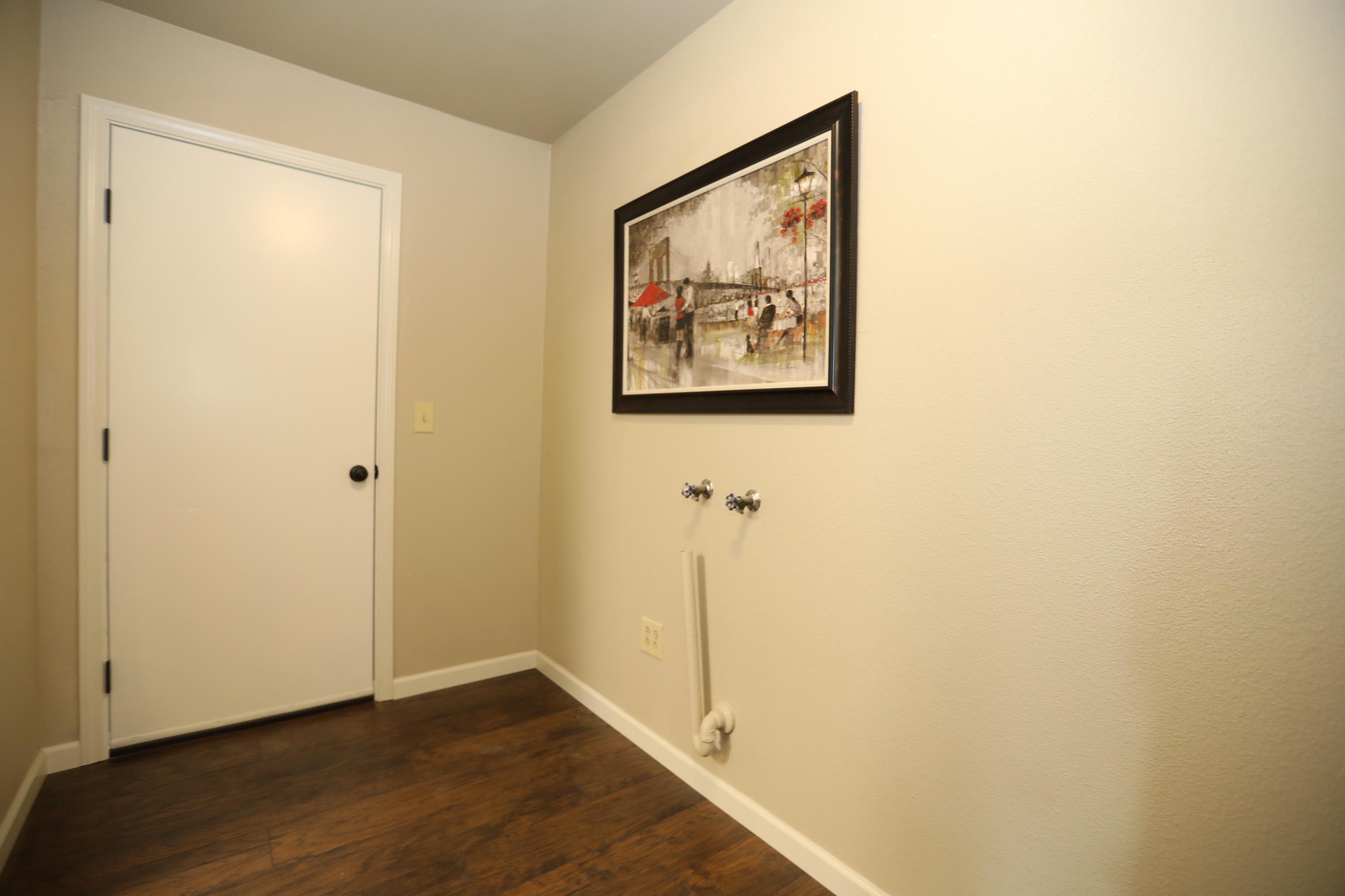 6560 Riverside Drive Redding, CA 96001 - Photo 6 of 15 a view of a hallway with wooden floor