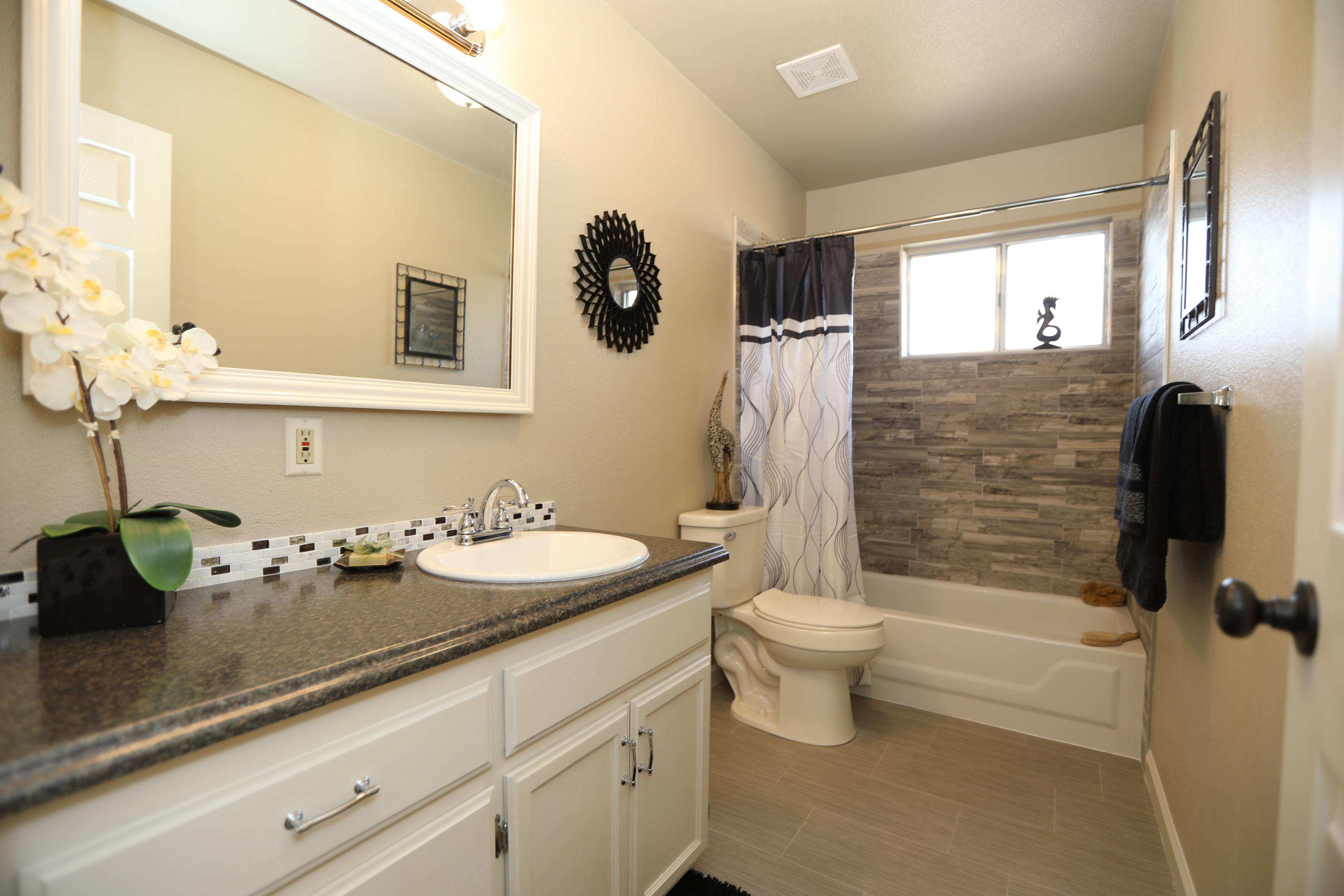 6560 Riverside Drive Redding, CA 96001 - Photo 9 of 15 a bathroom with a sink a toilet and shower