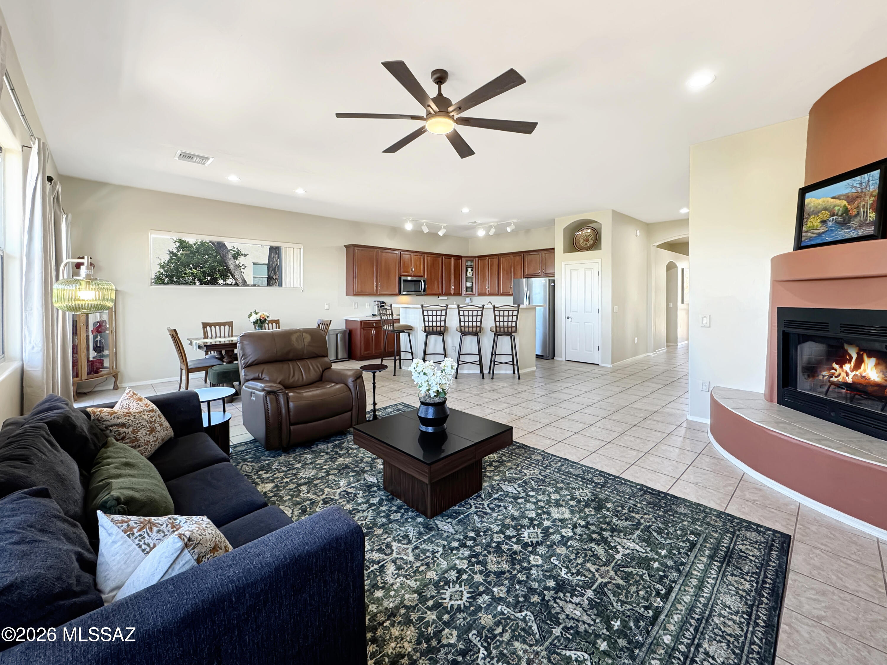 10835 South Heart Break Ridge Place Vail, AZ 85641 - Photo 12 of 49 a living room with furniture and a fireplace