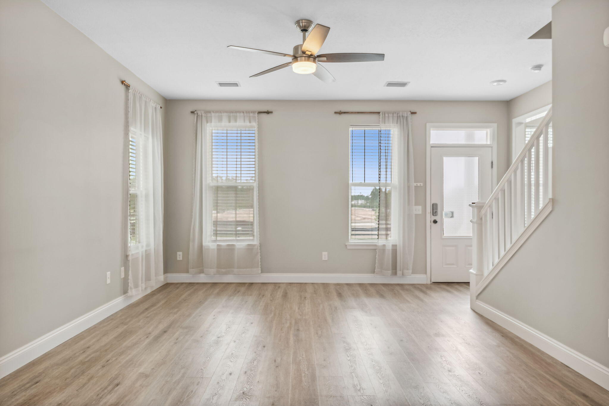 275 Indian Woman Road Santa Rosa Beach, FL 32459 - Photo 13 of 41 wooden floor in an empty room with a window