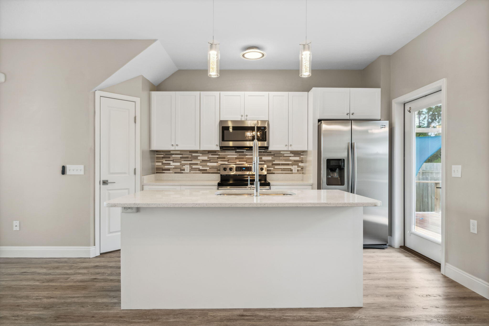 275 Indian Woman Road Santa Rosa Beach, FL 32459 - Photo 19 of 41 a kitchen with kitchen island a counter top space stainless steel appliances and cabinets