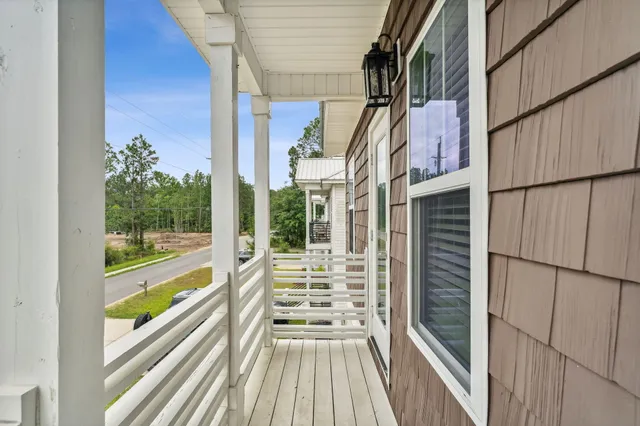 a view of balcony with wooden floor