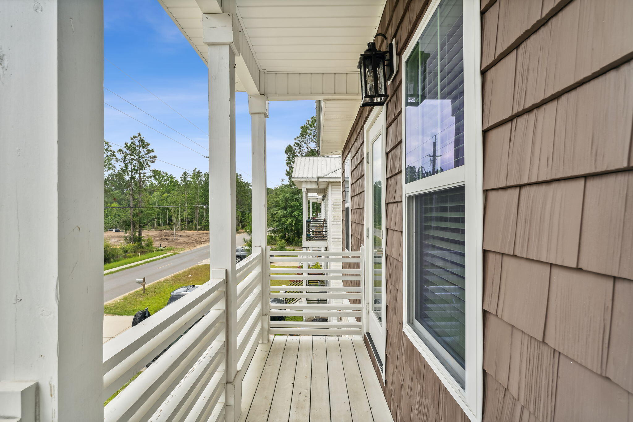 275 Indian Woman Road Santa Rosa Beach, FL 32459 - Photo 27 of 41 a view of balcony with wooden floor