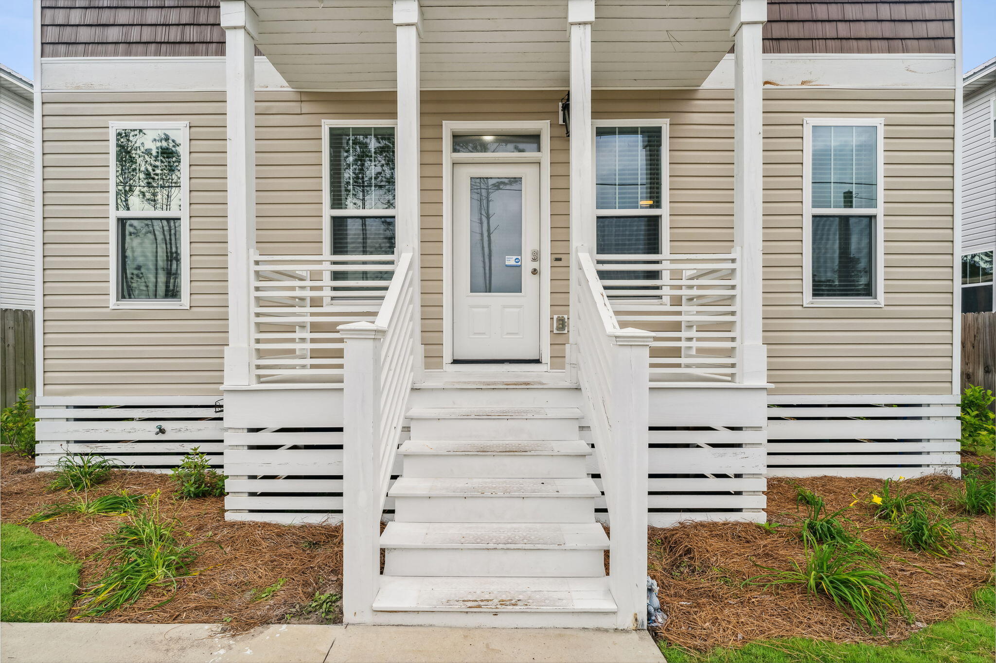 275 Indian Woman Road Santa Rosa Beach, FL 32459 - Photo 3 of 41 a view of a house with entryway and windows