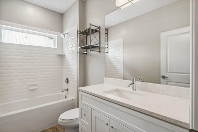 a bathroom with a sink a toilet and a bathtub