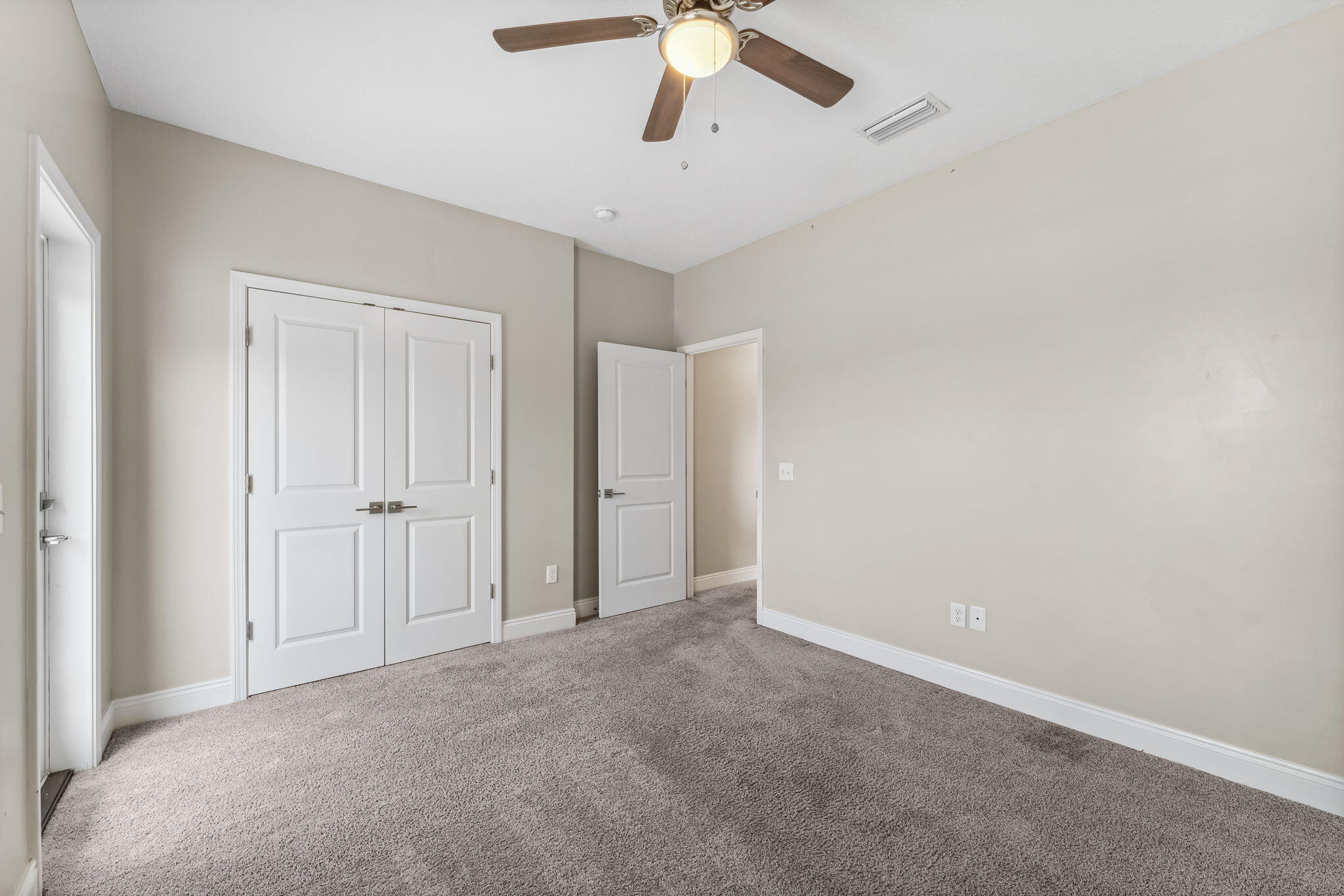 275 Indian Woman Road Santa Rosa Beach, FL 32459 - Photo 34 of 41 a view of an empty room and chandelier fan