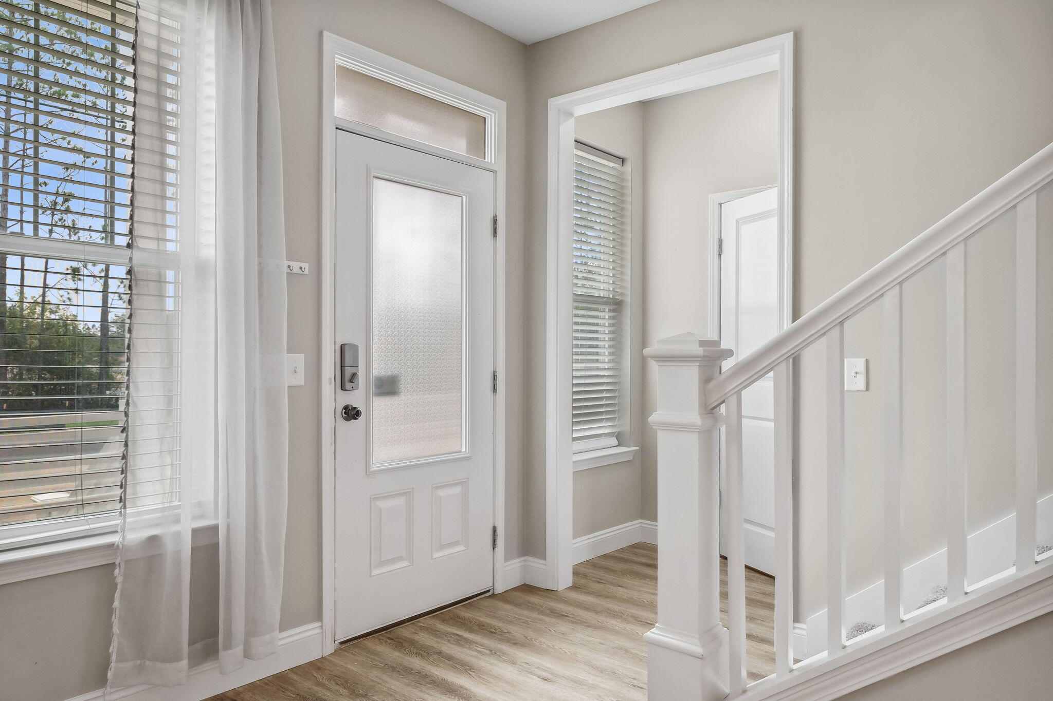 275 Indian Woman Road Santa Rosa Beach, FL 32459 - Photo 4 of 41 a view of a hallway with wooden floor and entryway
