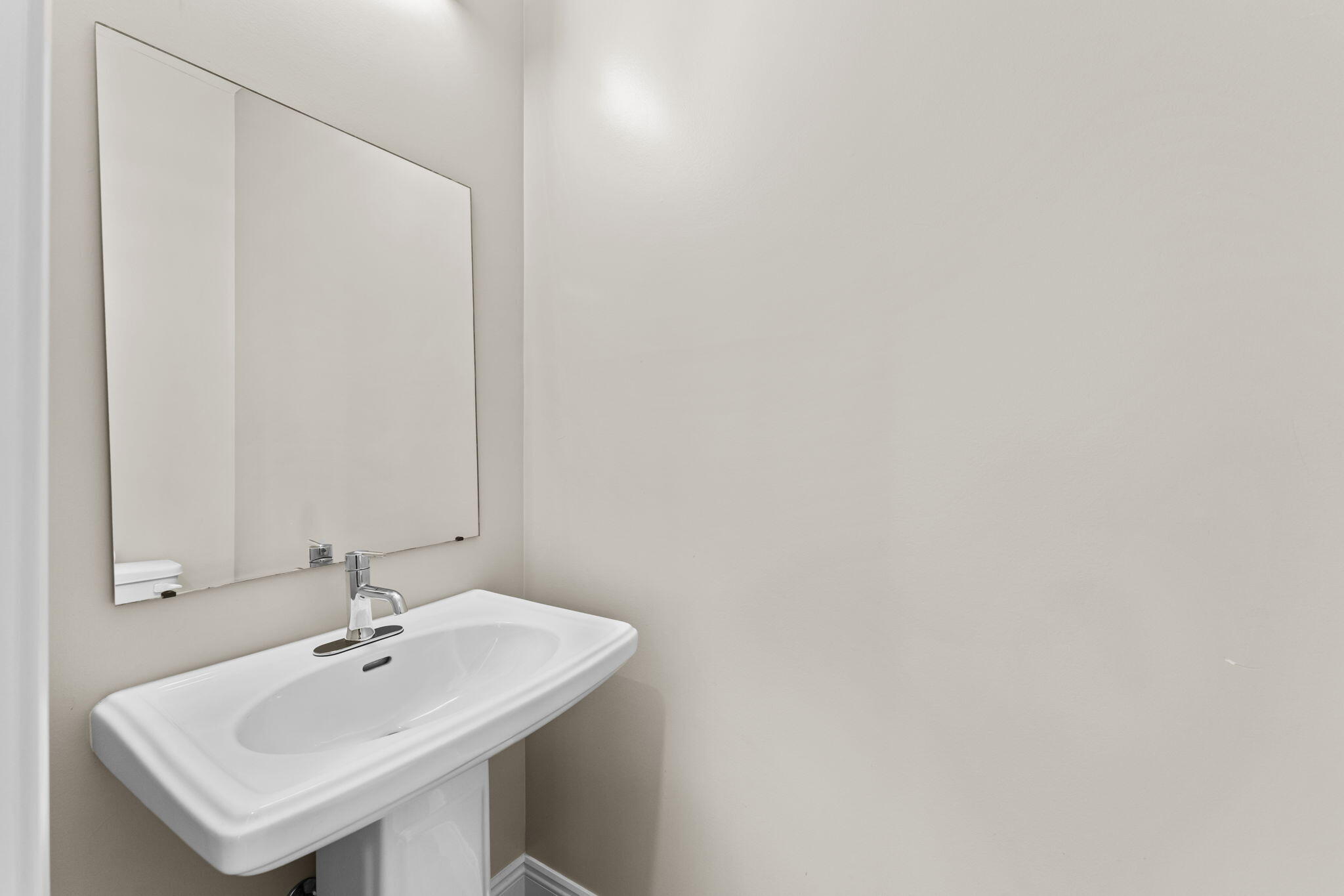 275 Indian Woman Road Santa Rosa Beach, FL 32459 - Photo 5 of 41 a bathroom with a sink and a mirror