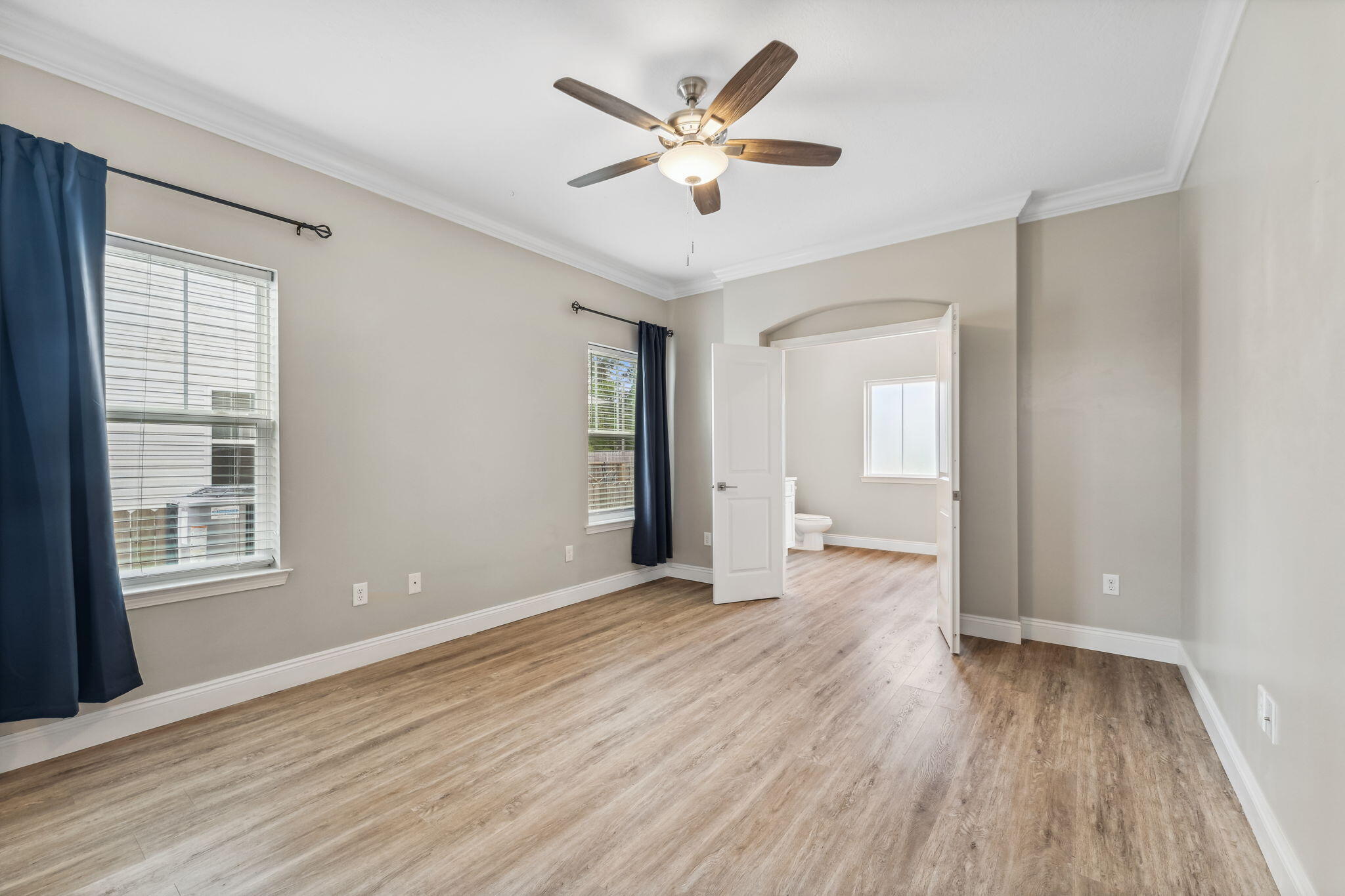 275 Indian Woman Road Santa Rosa Beach, FL 32459 - Photo 6 of 41 a view of an empty room with wooden floor and a window