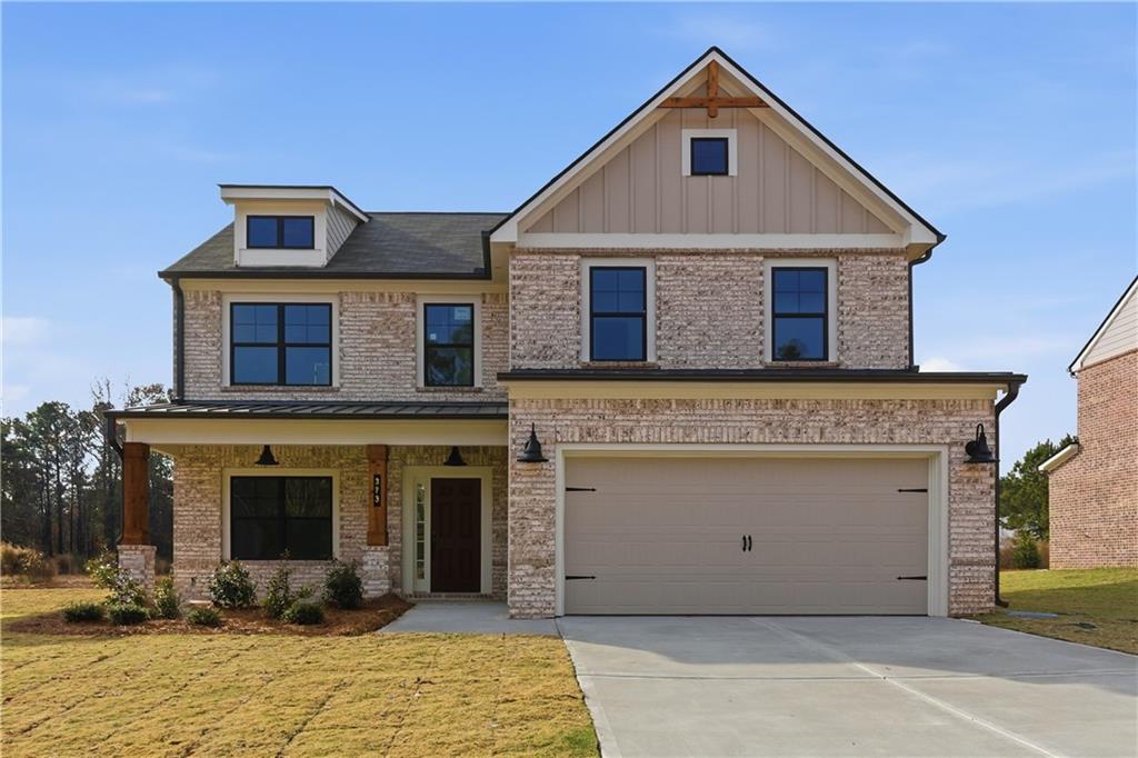 373 Waterbluff Drive Southwest Mableton, GA 30126 - Photo 1 of 21 a front view of a house with yard