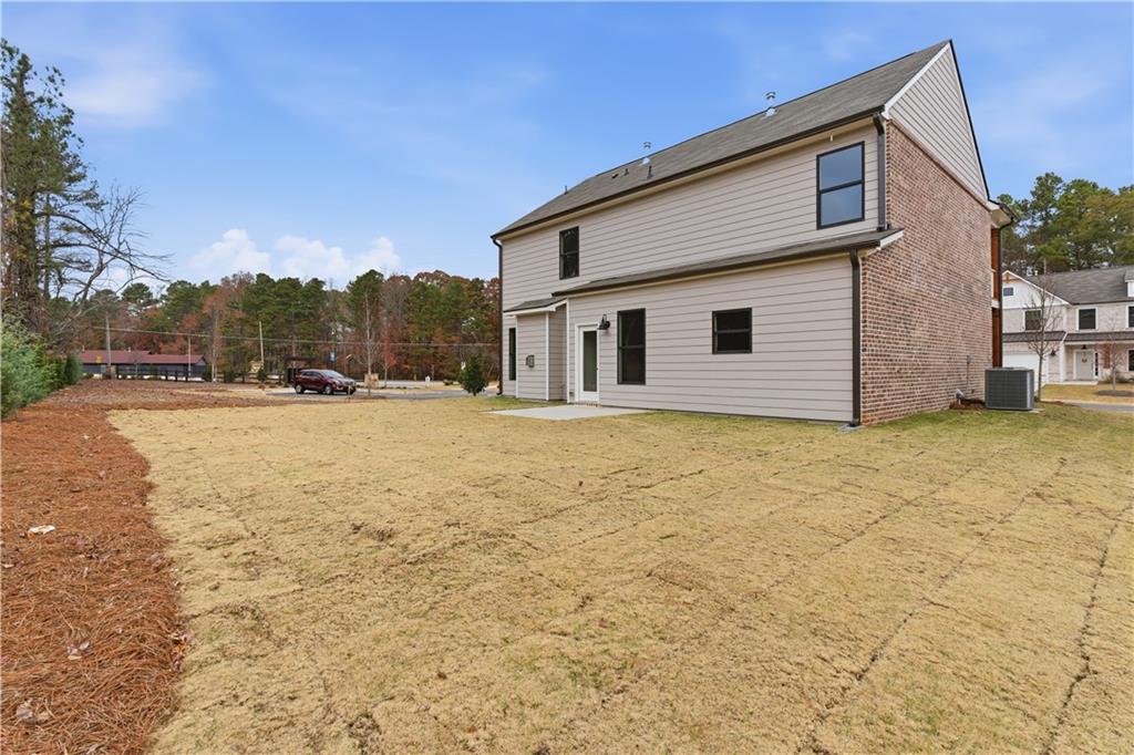 373 Waterbluff Drive Southwest Mableton, GA 30126 - Photo 20 of 21 a view of a house with a yard