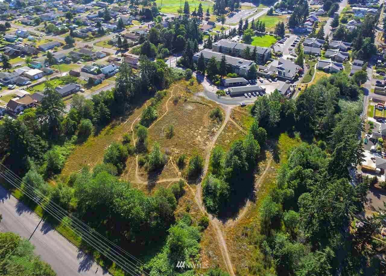 an aerial view of residential house with swimming pool and outdoor space